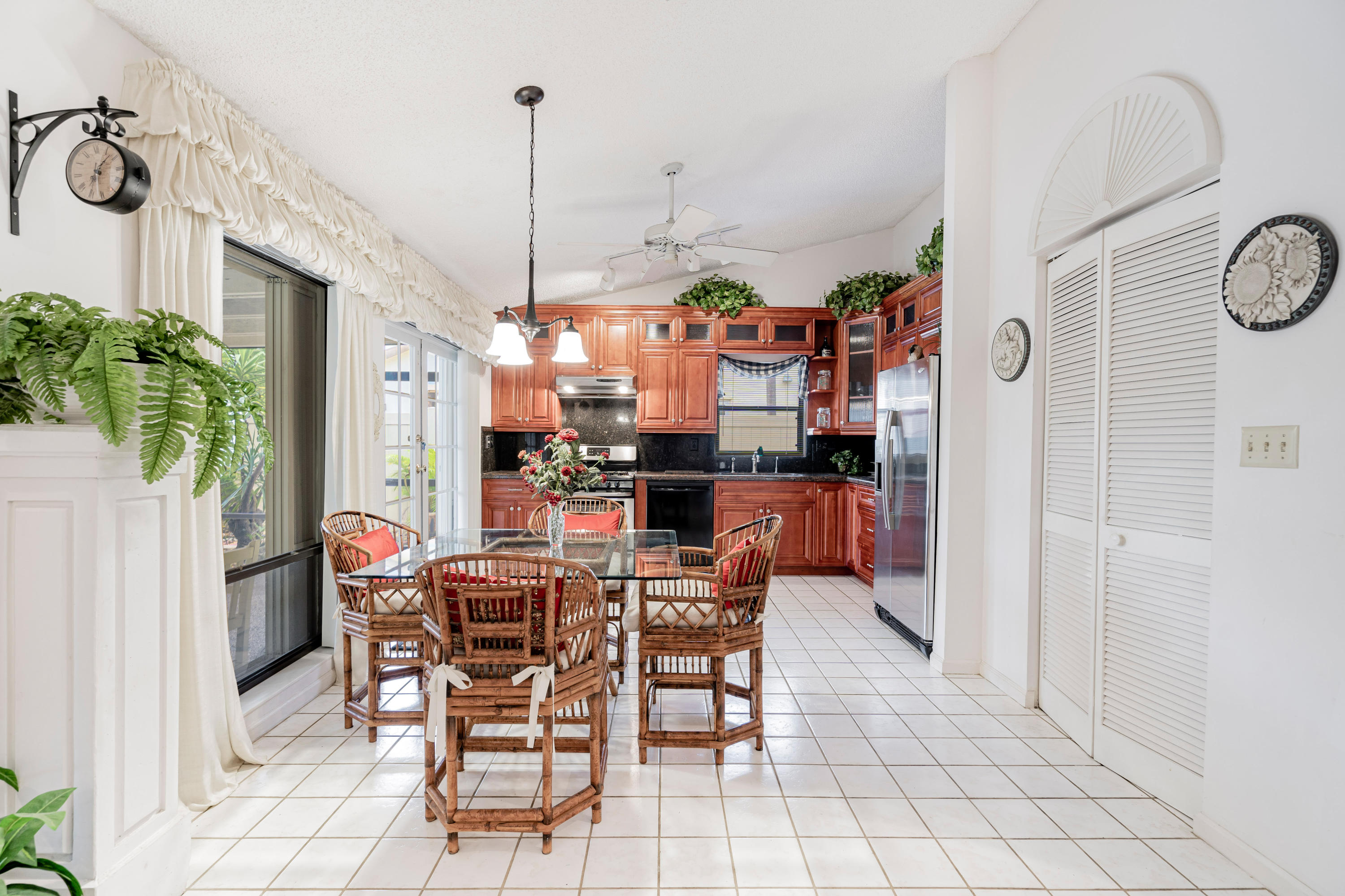 861 Camino Gardens Lane Boca Raton, FL 33432 - Photo 13 of 37 a view of a dining room with furniture