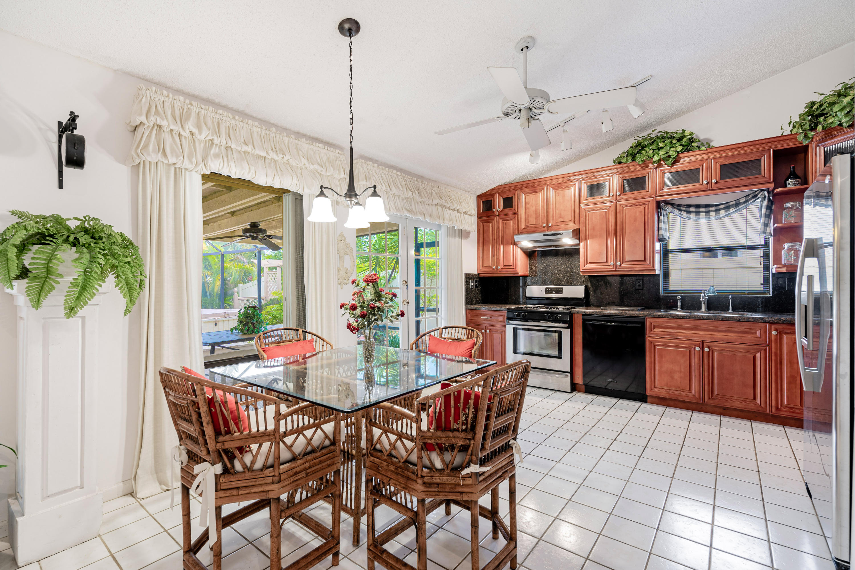 861 Camino Gardens Lane Boca Raton, FL 33432 - Photo 14 of 37 a view of a kitchen with kitchen island granite countertop lots of counter top space and stainless steel appliances