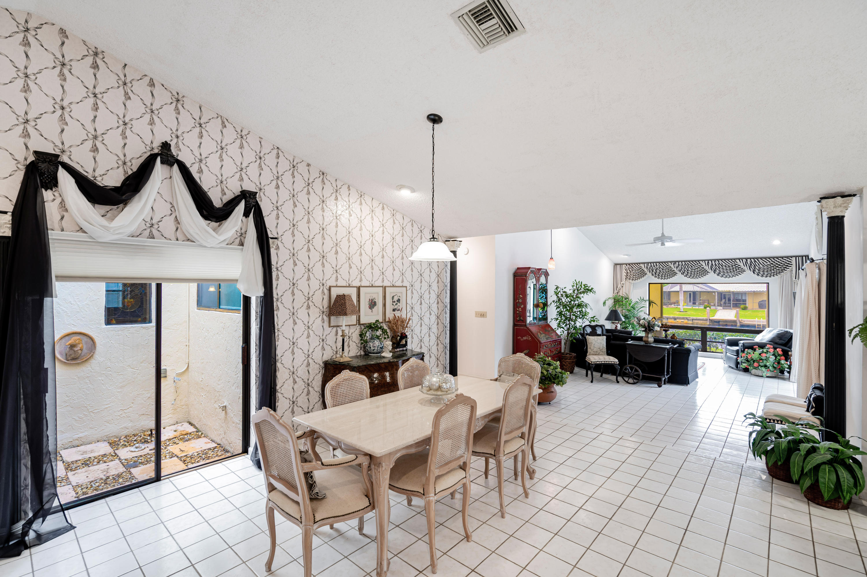 861 Camino Gardens Lane Boca Raton, FL 33432 - Photo 18 of 37 a view of a dining room with furniture
