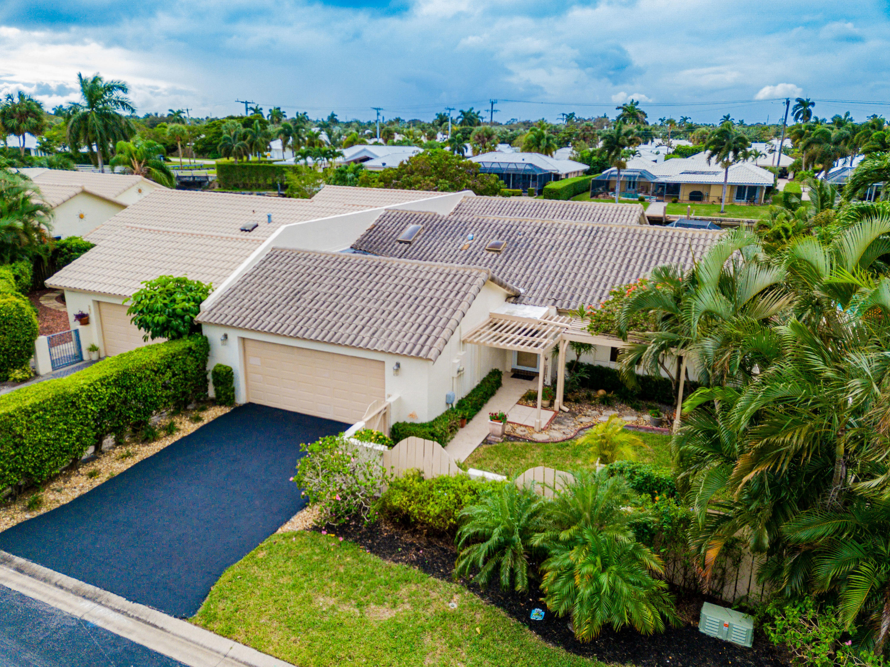 861 Camino Gardens Lane Boca Raton, FL 33432 - Photo 2 of 37 an aerial view of a house with pool yard and outdoor seating