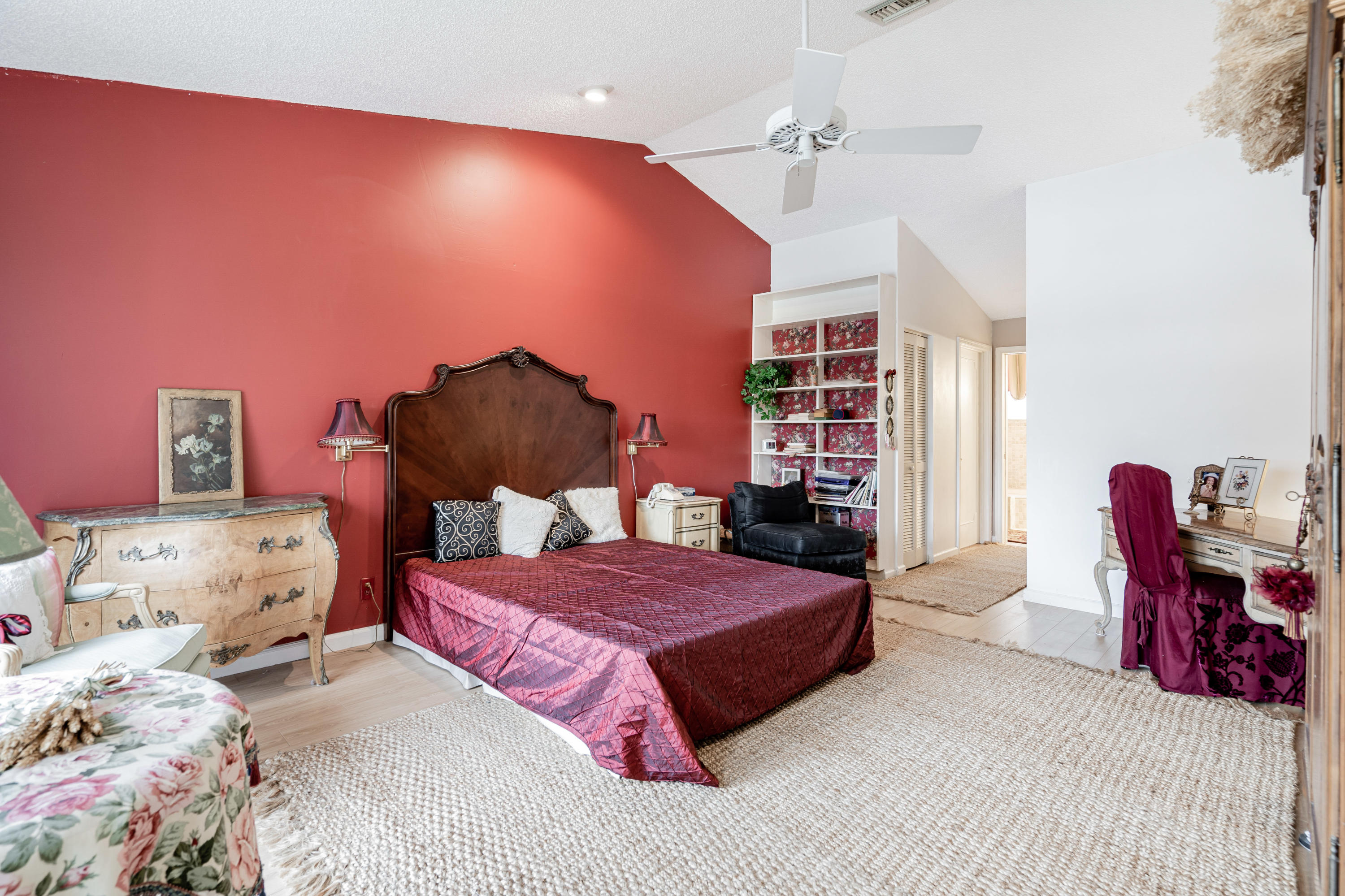 861 Camino Gardens Lane Boca Raton, FL 33432 - Photo 23 of 37 a bedroom with a bed and dresser with the shoe rack
