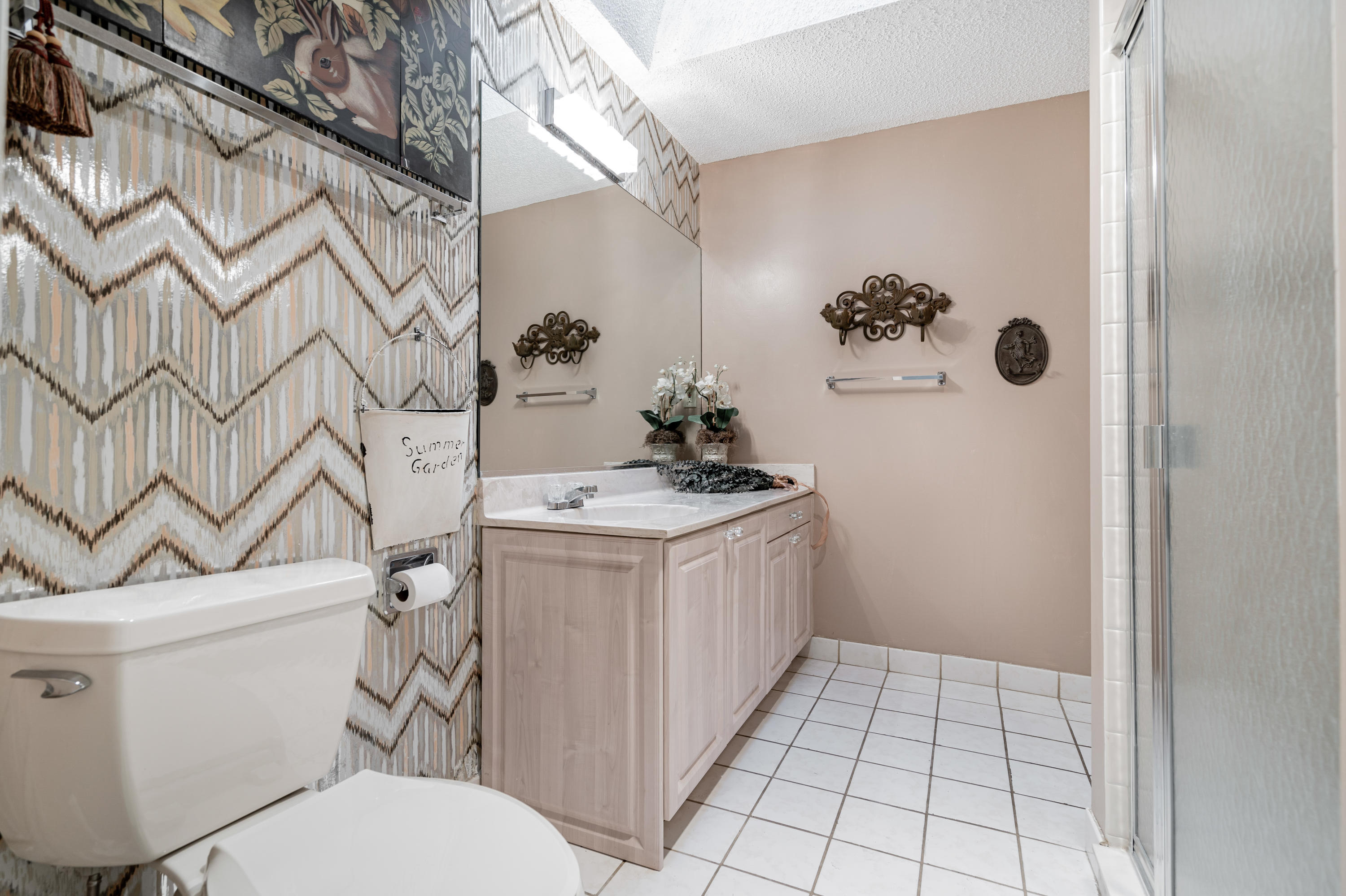 861 Camino Gardens Lane Boca Raton, FL 33432 - Photo 24 of 37 a bathroom with a sink toilet and shower