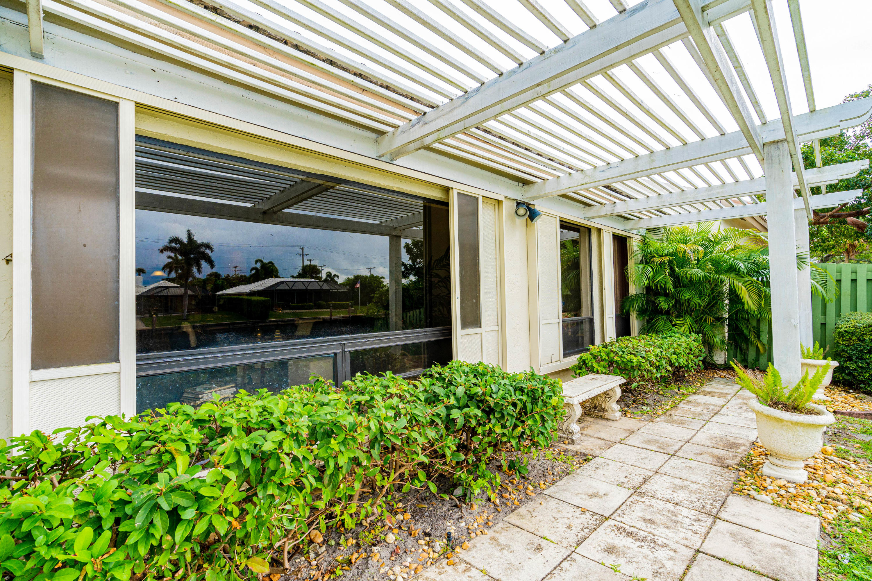 861 Camino Gardens Lane Boca Raton, FL 33432 - Photo 35 of 37 a front view of house with a garden