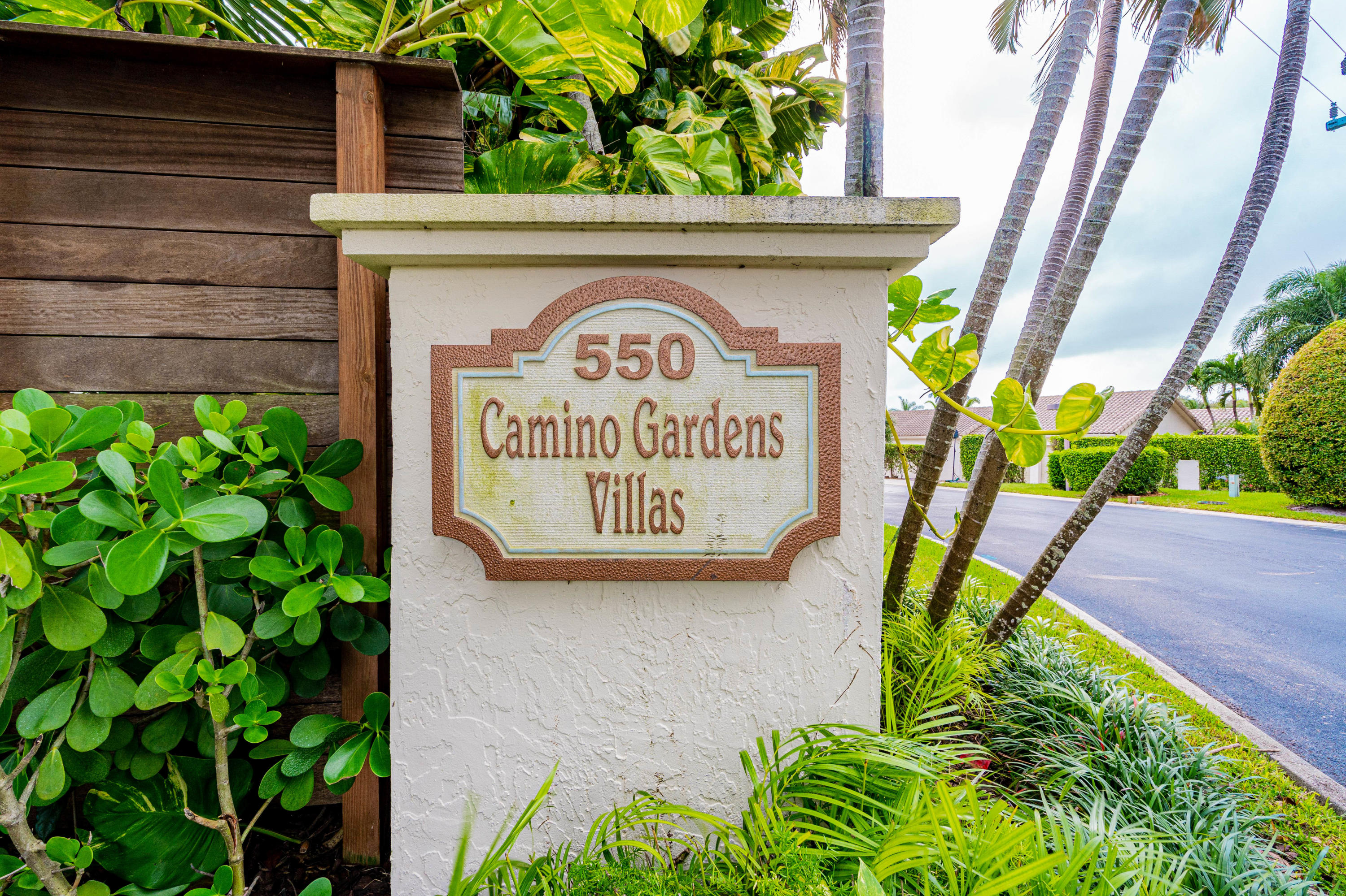 861 Camino Gardens Lane Boca Raton, FL 33432 - Photo 6 of 37 a sign on the side of a building