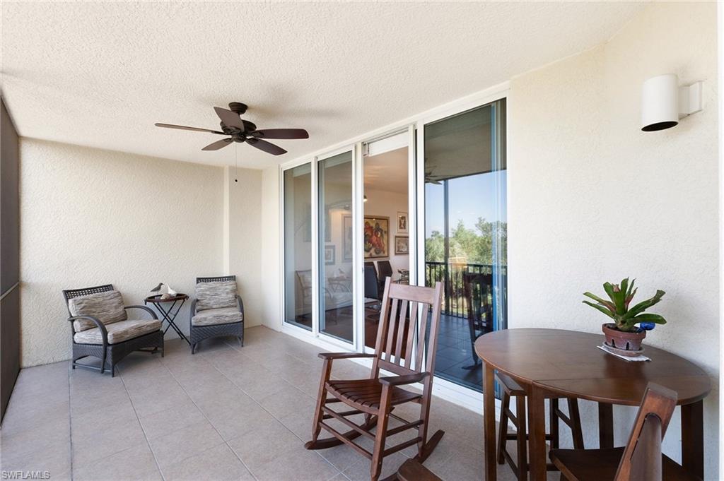 1065 Borghese Lane, Unit 203 Naples, FL 34114 - Photo 15 of 24 a view of a livingroom with furniture and a potted plant