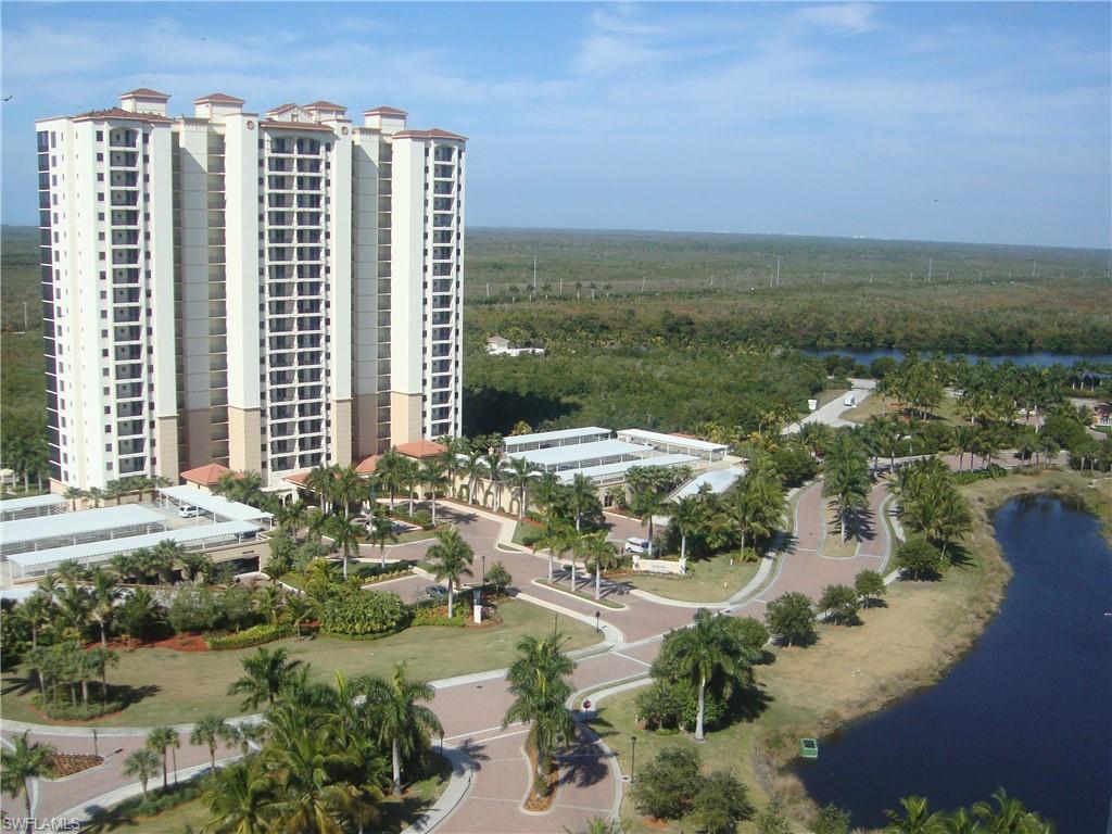 1065 Borghese Lane, Unit 203 Naples, FL 34114 - Photo 24 of 24 a view of a lake with a city