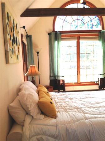 120 Stow Road Boxborough, MA 01719 - Photo 15 of 30 a bedroom with a bed and a large window with outer view