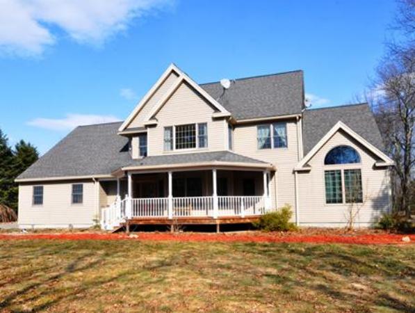 120 Stow Road Boxborough, MA 01719 - Photo 27 of 30 a front view of a house with a yard