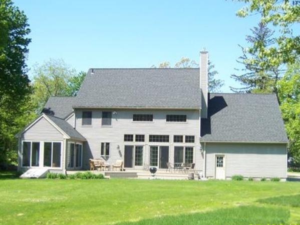 120 Stow Road Boxborough, MA 01719 - Photo 28 of 30 front view of a house with a yard