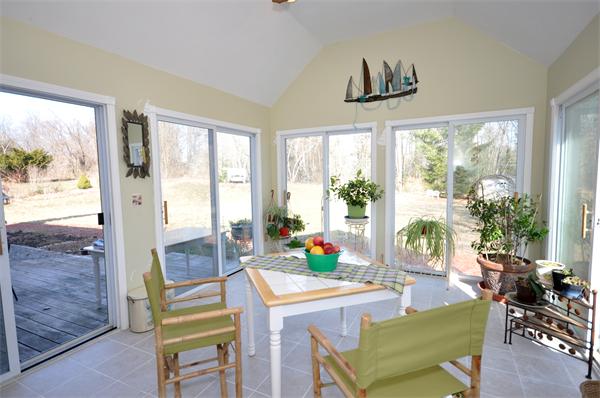 120 Stow Road Boxborough, MA 01719 - Photo 10 of 30 a living room with furniture a flat screen tv and a large window