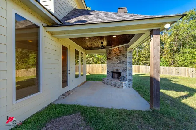 a view of backyard with plants and outdoor seating