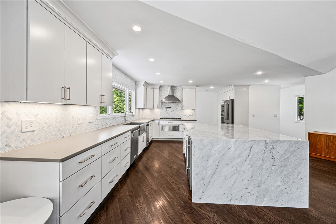 118 Beacon Ridge Circle Salem, SC 29676 - Photo 7 of 45 Culinary dreams come to life in this kitchen, featuring an expansive marble island and premium appliances.