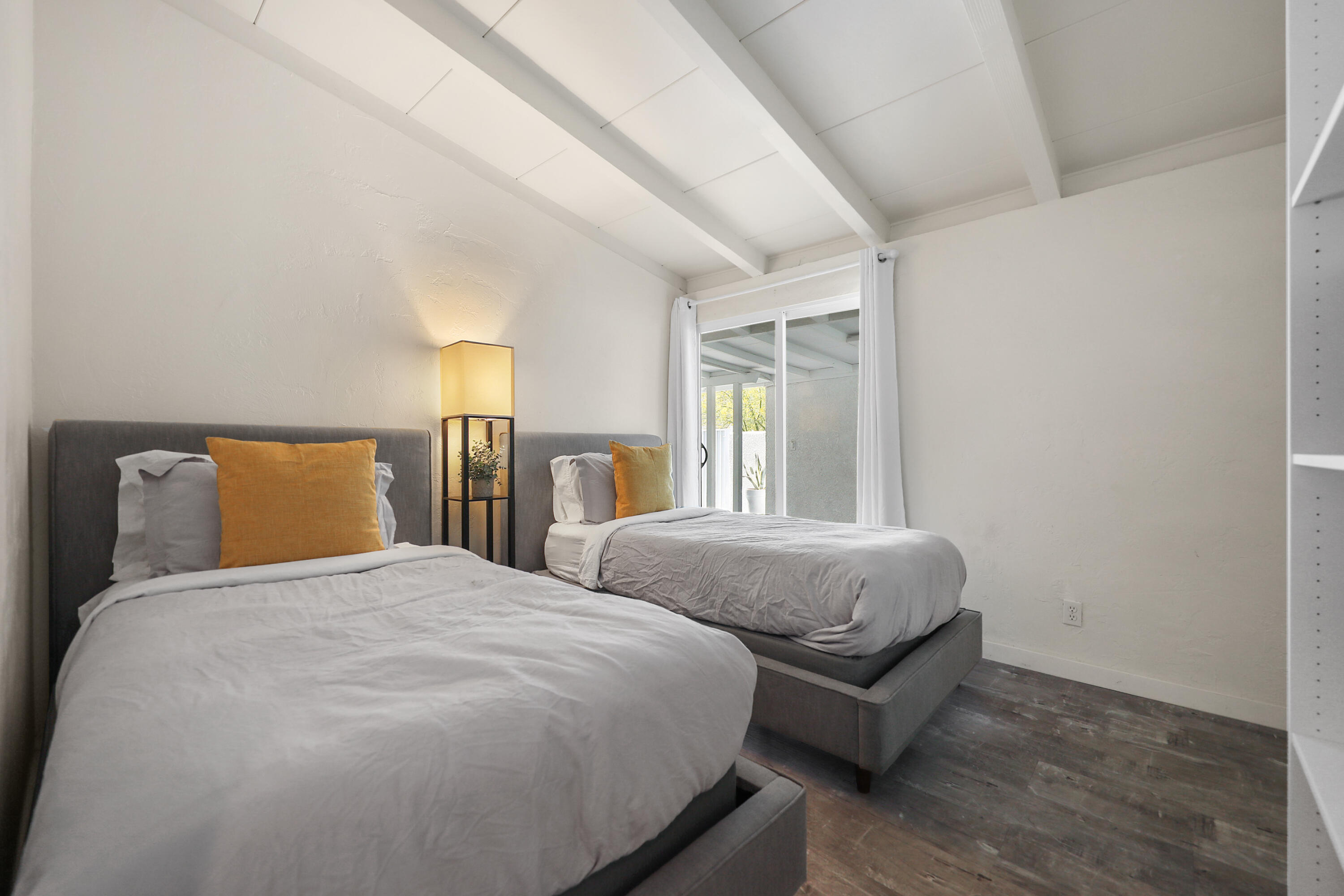 71767 Tunis Road Rancho Mirage, CA 92270 - Photo 13 of 30 a bedroom with two beds and painting on the wall