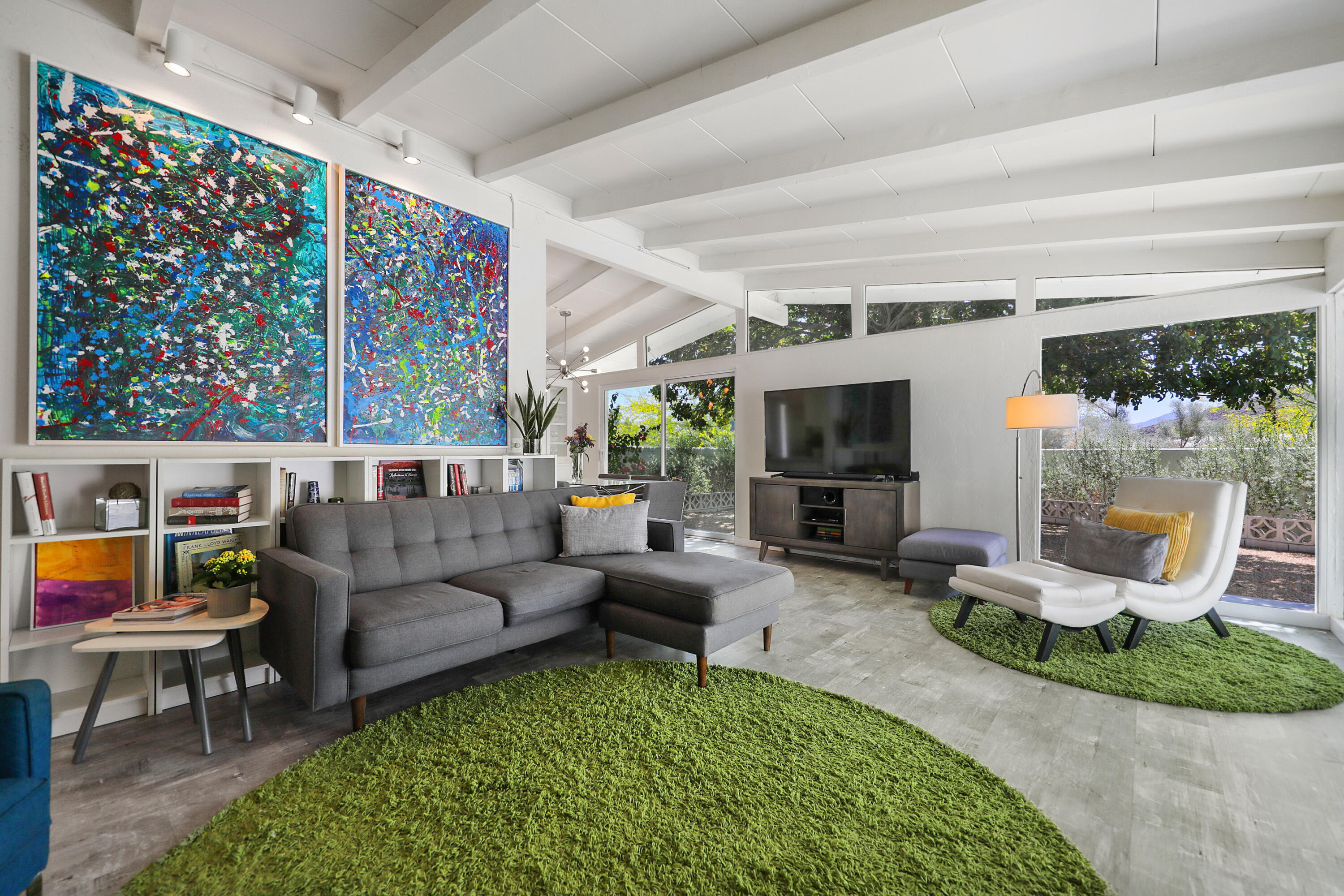 71767 Tunis Road Rancho Mirage, CA 92270 - Photo 2 of 30 a living room with furniture a flat screen tv and a fireplace
