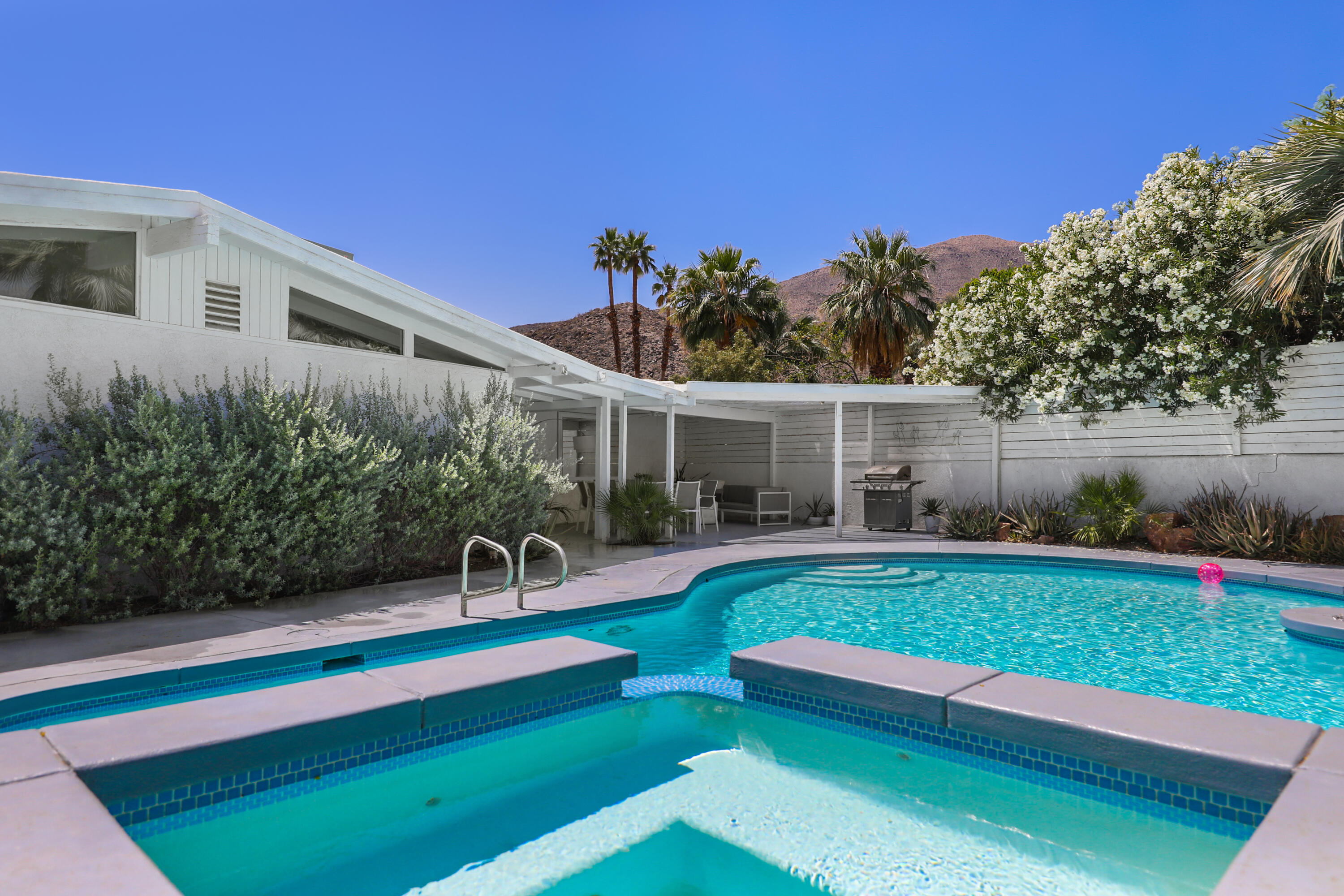 71767 Tunis Road Rancho Mirage, CA 92270 - Photo 25 of 30 a front view of a house with garden and a patio