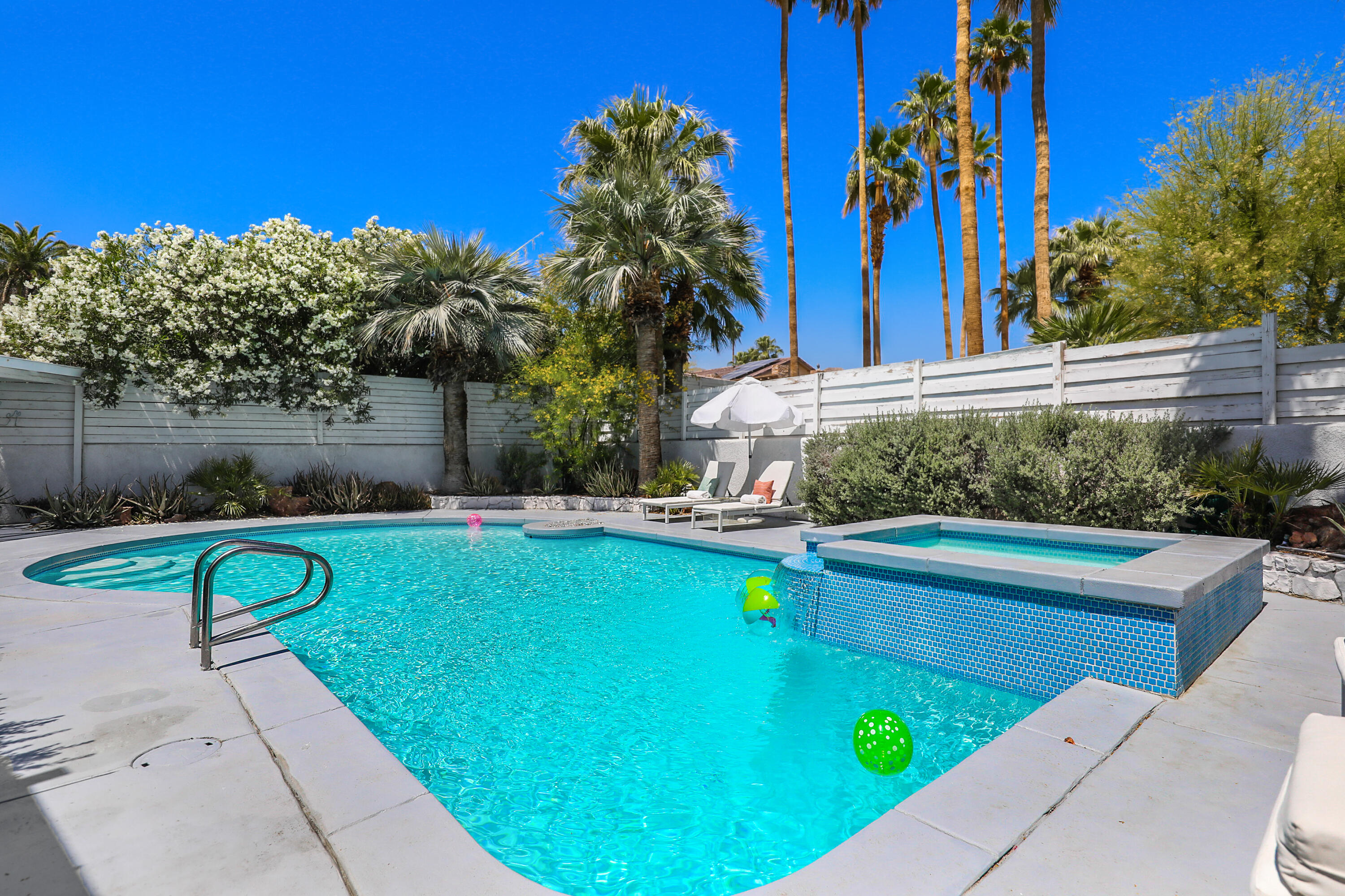 71767 Tunis Road Rancho Mirage, CA 92270 - Photo 26 of 30 a view of a swimming pool with a yard and plants
