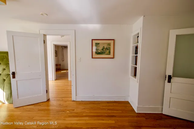 an aerial view of a house with swimming pool and porch