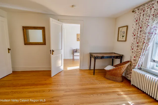 an aerial view of a house with garden space and street view