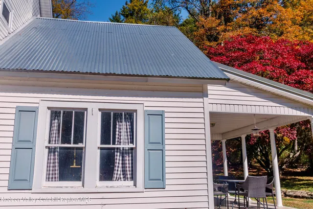 a view of a lush green forest with a mountain