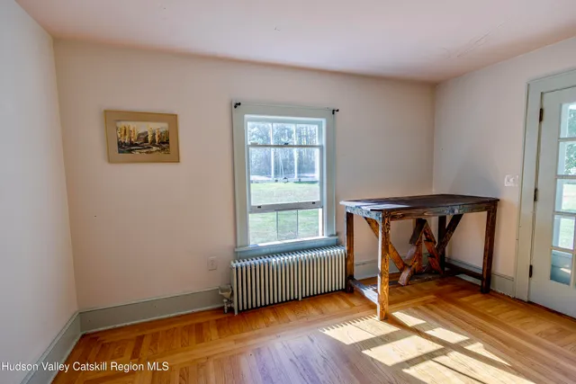 a view of a livingroom with furniture and a fireplace