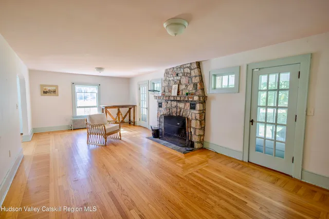 a workspace with wooden floor and a book shelf