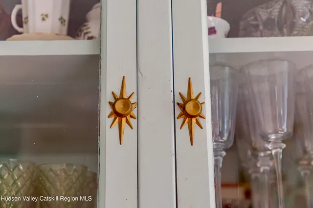 a view of a house with a tree beside it