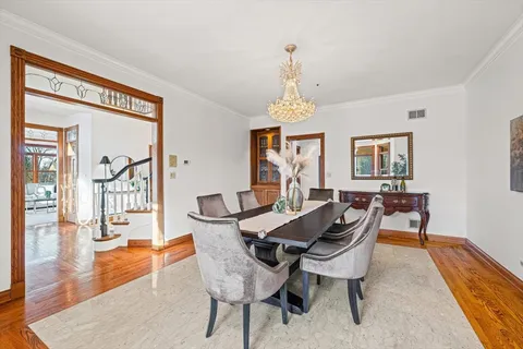 a living room with furniture a fireplace and large windows