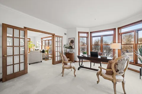 a kitchen with sink stove and refrigerator