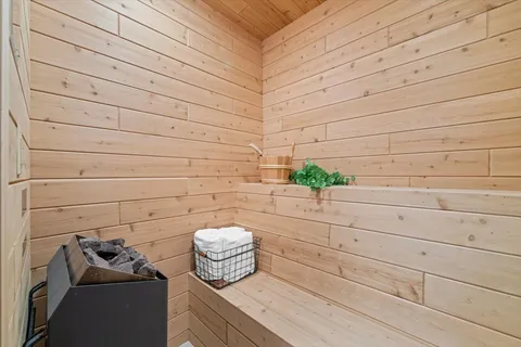 a spacious bedroom with a bed and a window