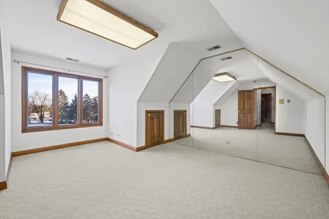 a bathroom with a double vanity sink a and a mirror