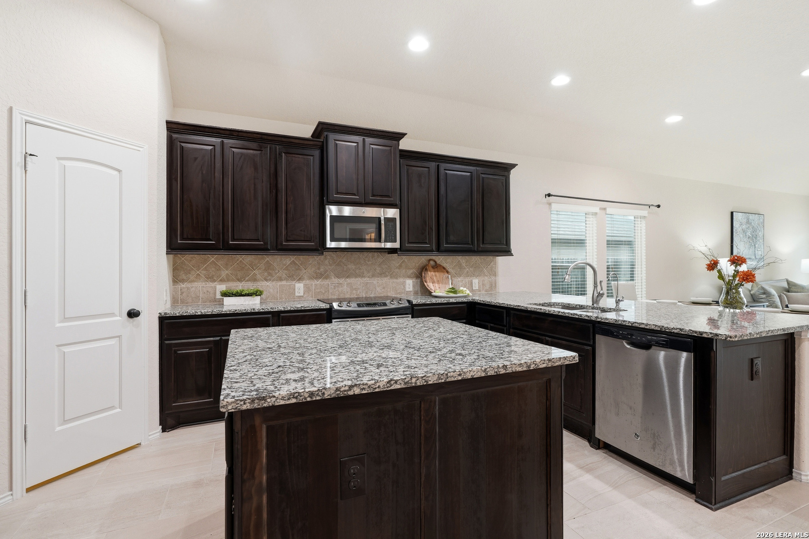 2129 Range Road Seguin, TX 78155 - Photo 10 of 41 a kitchen with a sink stove and microwave