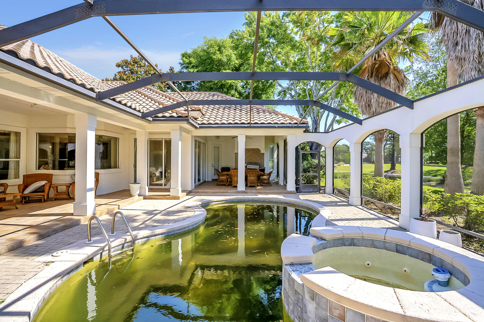 4372 Stonebridge Road Destin, FL 32541 - Photo 52 of 83 a view of a patio with swimming pool table and chairs