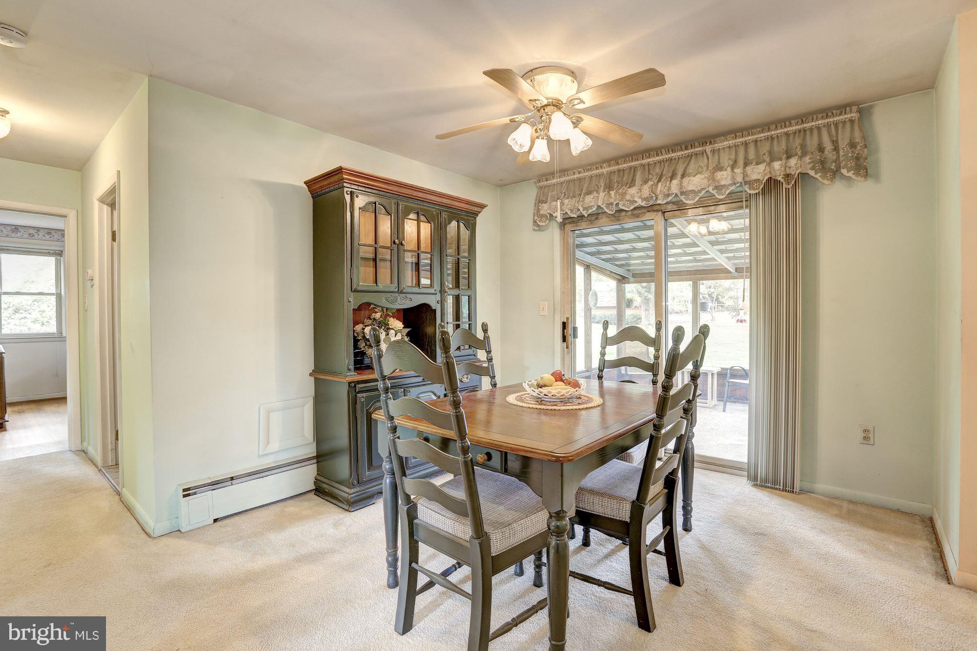 7833 Belgaro Road Laurel, MD 20723 - Photo 10 of 32 Dining room exits to screened porch