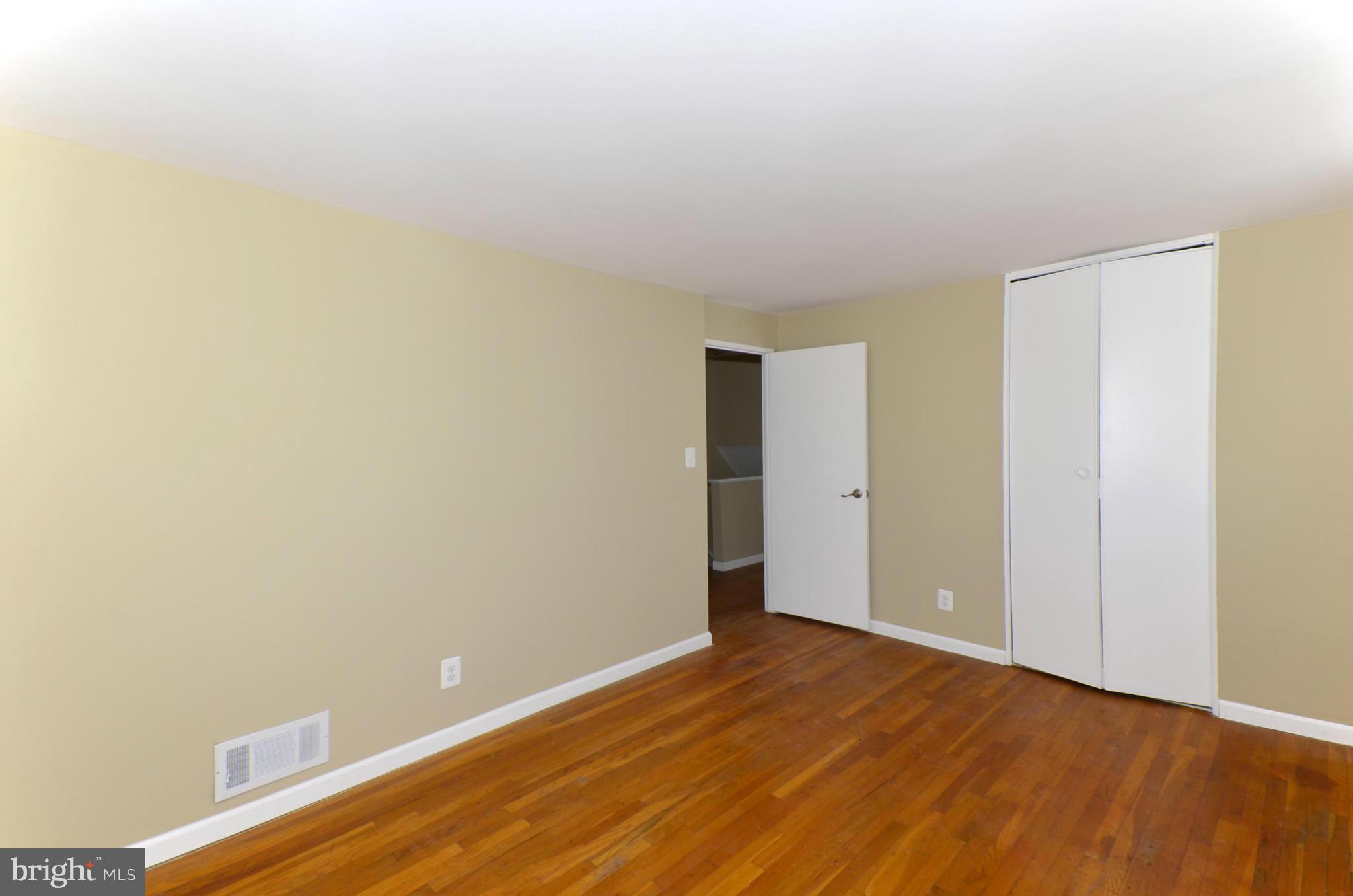 8058 Stratman Road Baltimore, MD 21222 - Photo 24 of 30 a view of an empty room with wooden floor