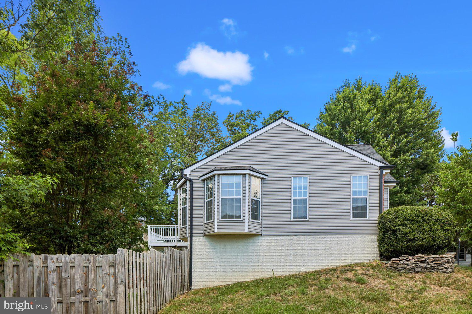 15764 Beau Ridge Drive Woodbridge, VA 22193 - Photo 50 of 58 a front view of a house with garden