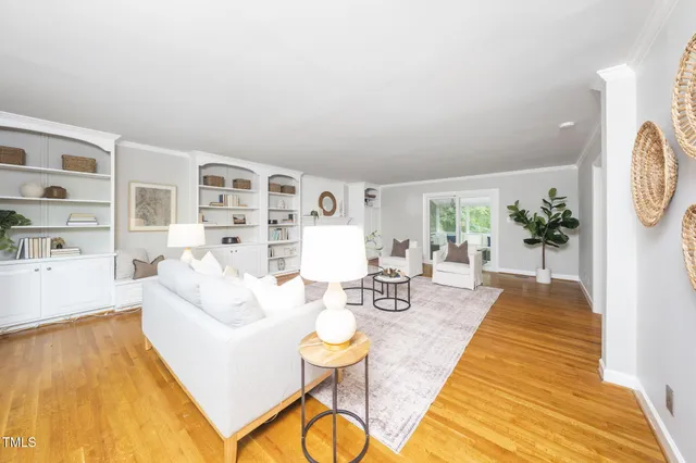 a living room with furniture and a table