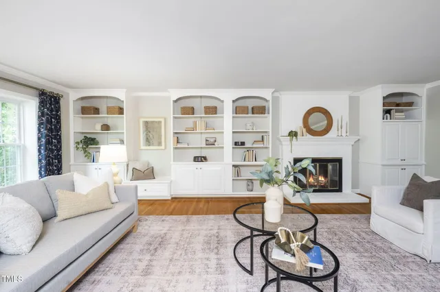 a living room with lots of furniture and a rug
