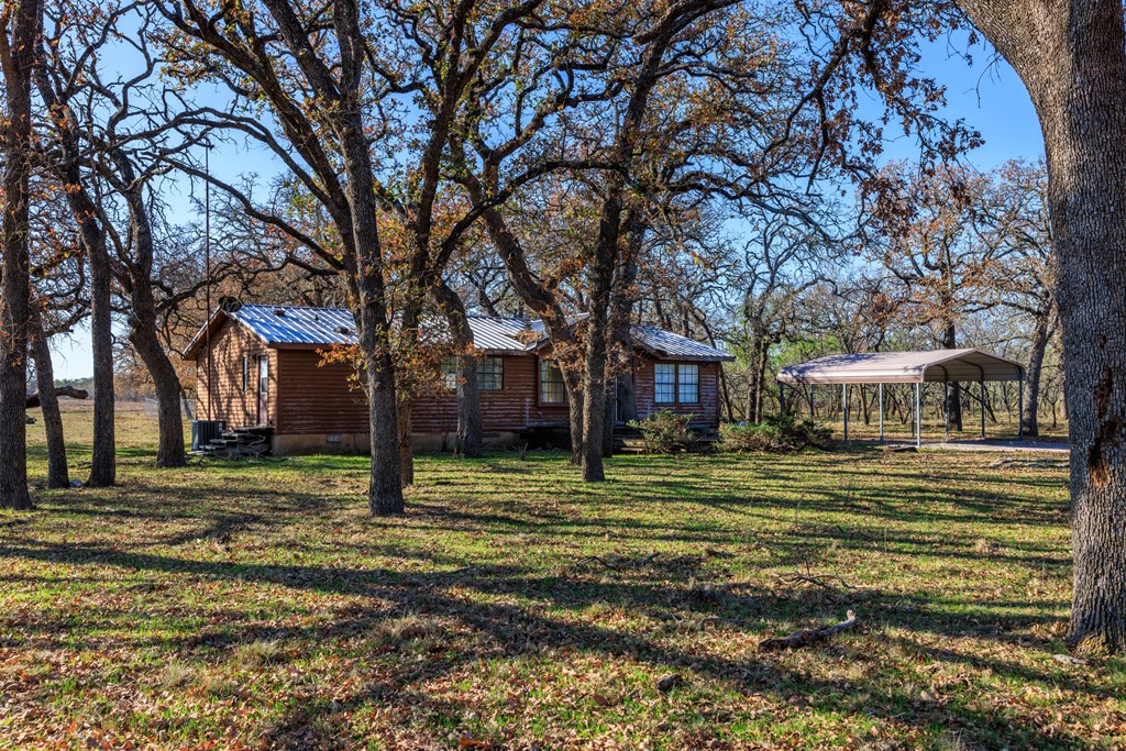 485 Fulton Ranch Road Stonewall, TX 78671 - Photo 20 of 22 a big tree in middle of the garden