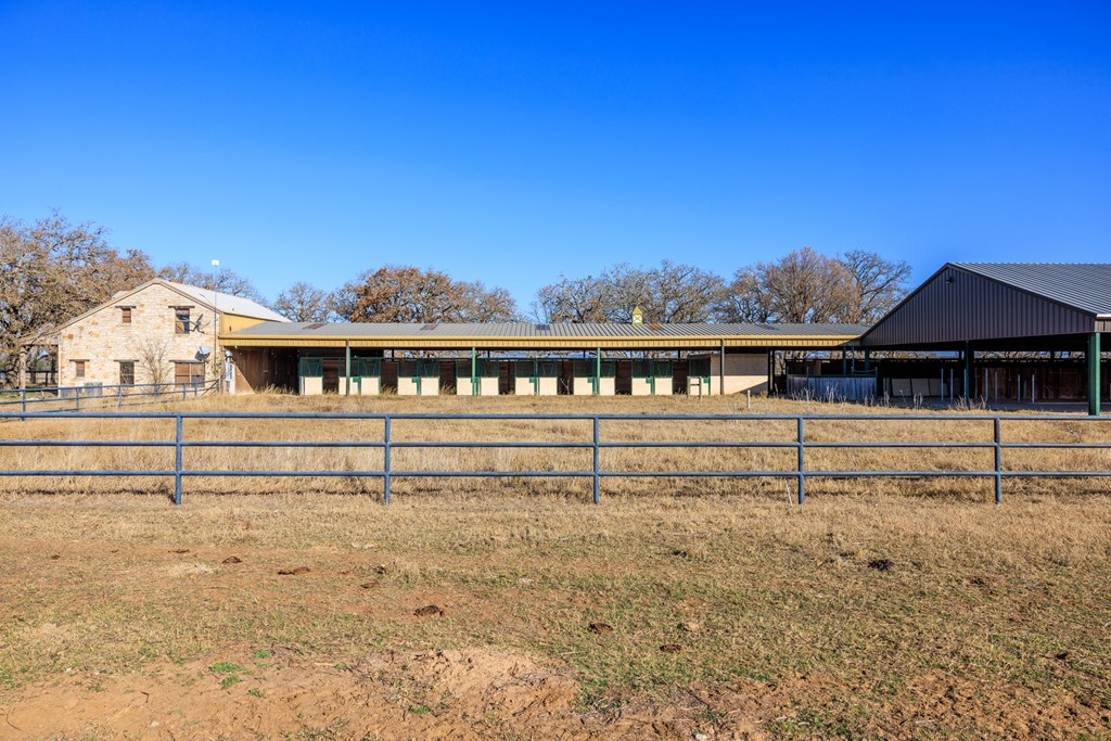 485 Fulton Ranch Road Stonewall, TX 78671 - Photo 21 of 22 a view of a house with a balcony
