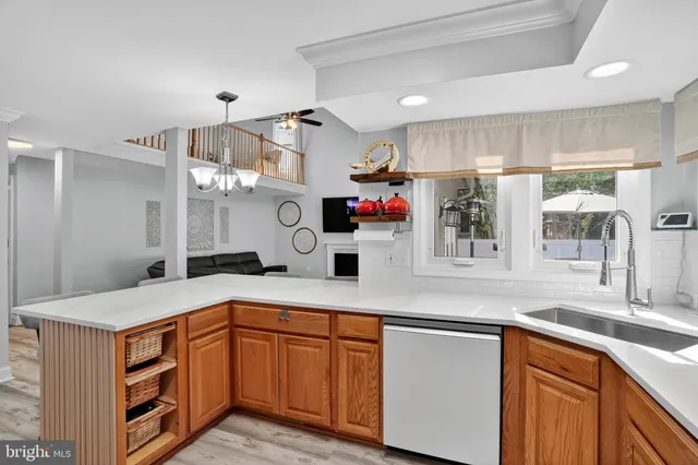 a kitchen with stainless steel appliances a sink and a refrigerator