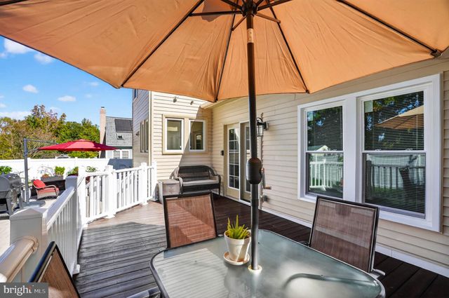 a outdoor space with patio the couches and pool table with chairs