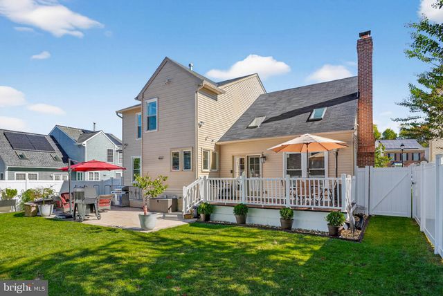 a front view of house with yard and outdoor seating