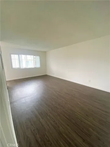 a kitchen with granite countertop white cabinets and stainless steel appliances