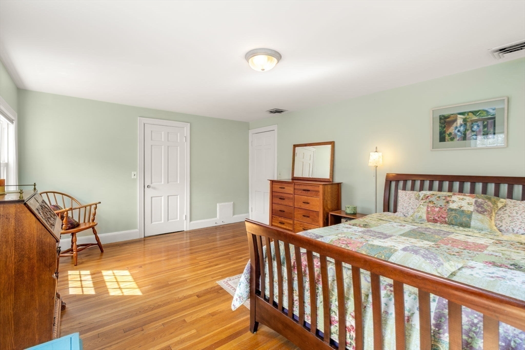 43 Palmer Road Newton, MA 02468 - Photo 15 of 40 a bedroom with a bed and wooden floor