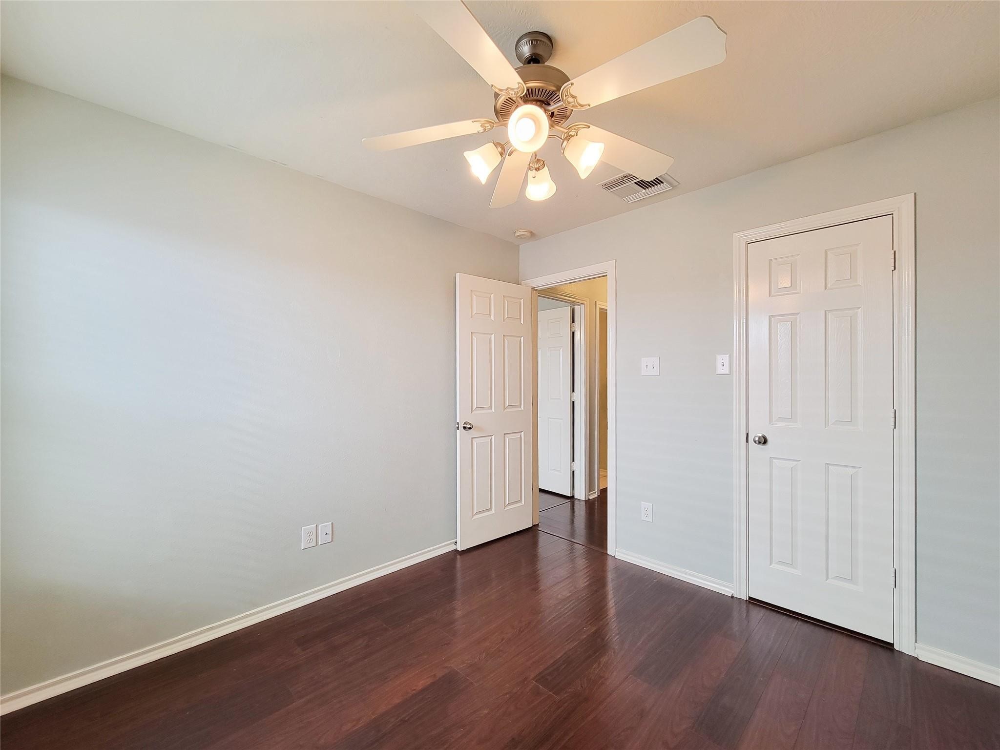 21722 Dimmett Way Spring, TX 77388 - Photo 14 of 38 a view of an empty room with wooden floor