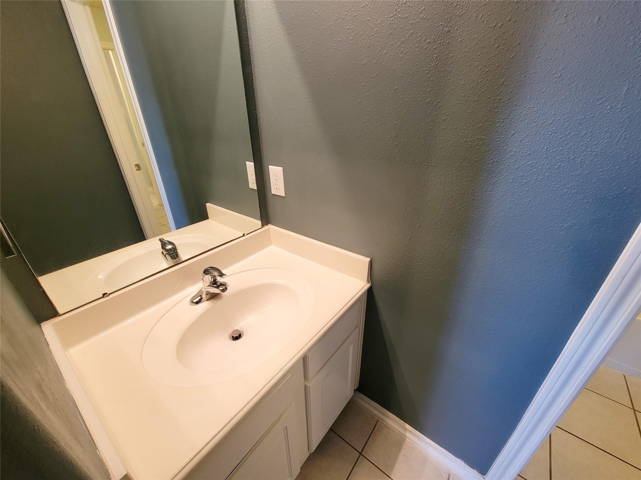 21722 Dimmett Way Spring, TX 77388 - Photo 21 of 38 a bathroom with a sink and a mirror
