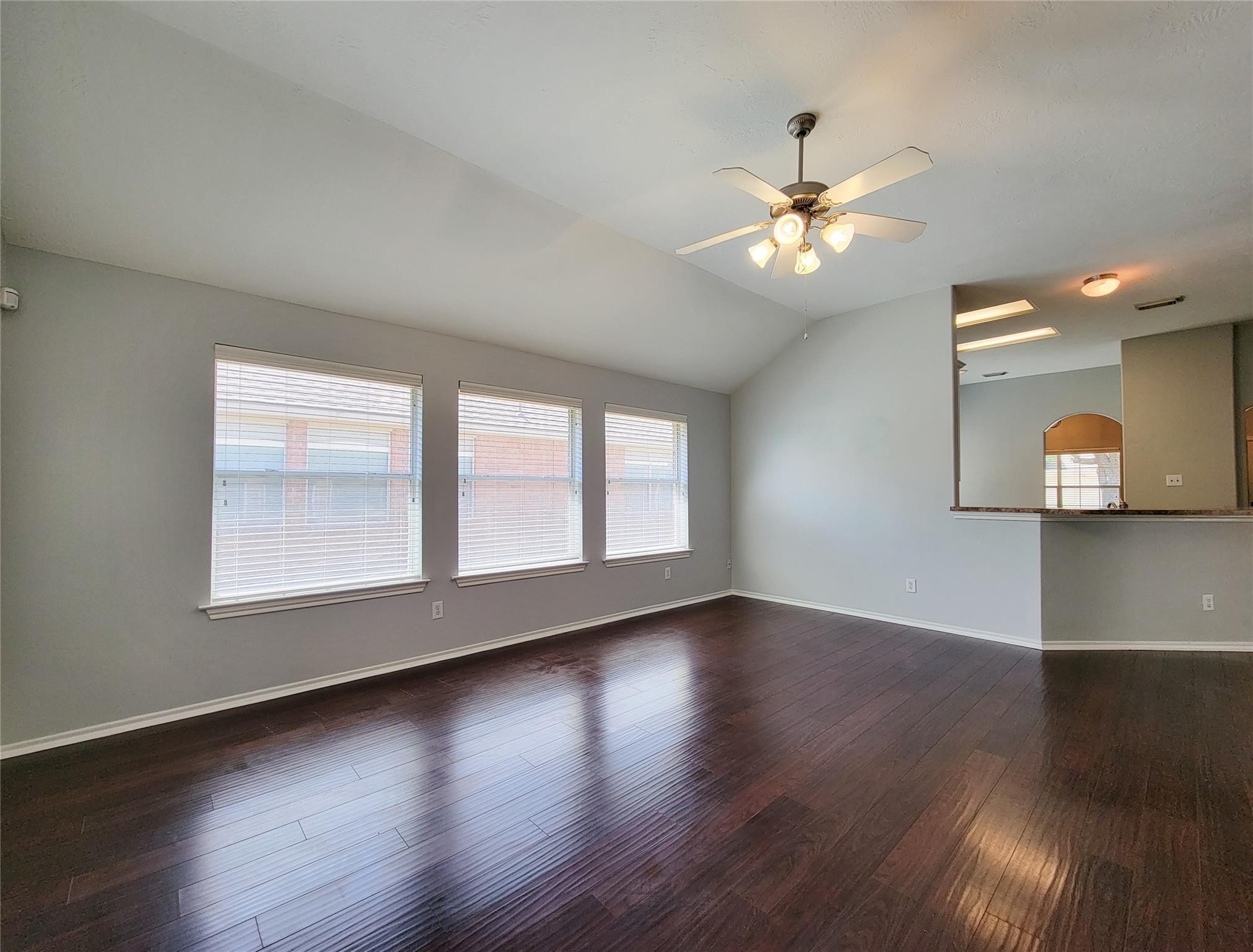 21722 Dimmett Way Spring, TX 77388 - Photo 27 of 38 a view of an empty room with wooden floor and a window