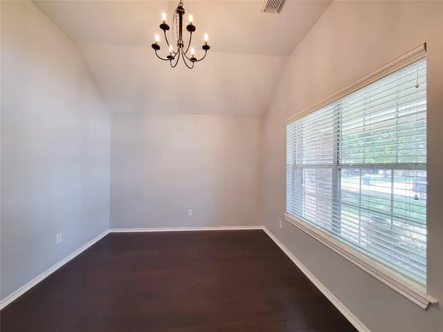 a view of a room that has a window in it