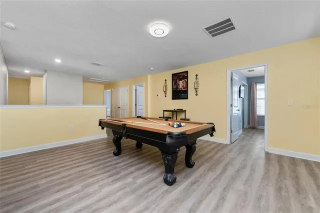 a view of a livingroom with furniture and wooden floor