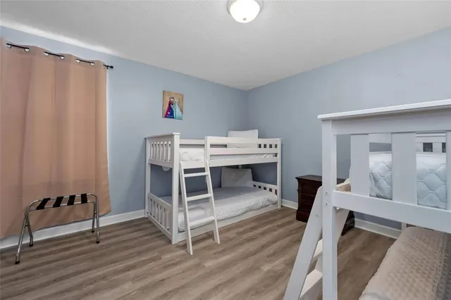 a workspace with furniture window and wooden floor